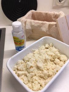 Okara (lees), nigiri and the prepared wooden box to drain the tofu later on (front to back)