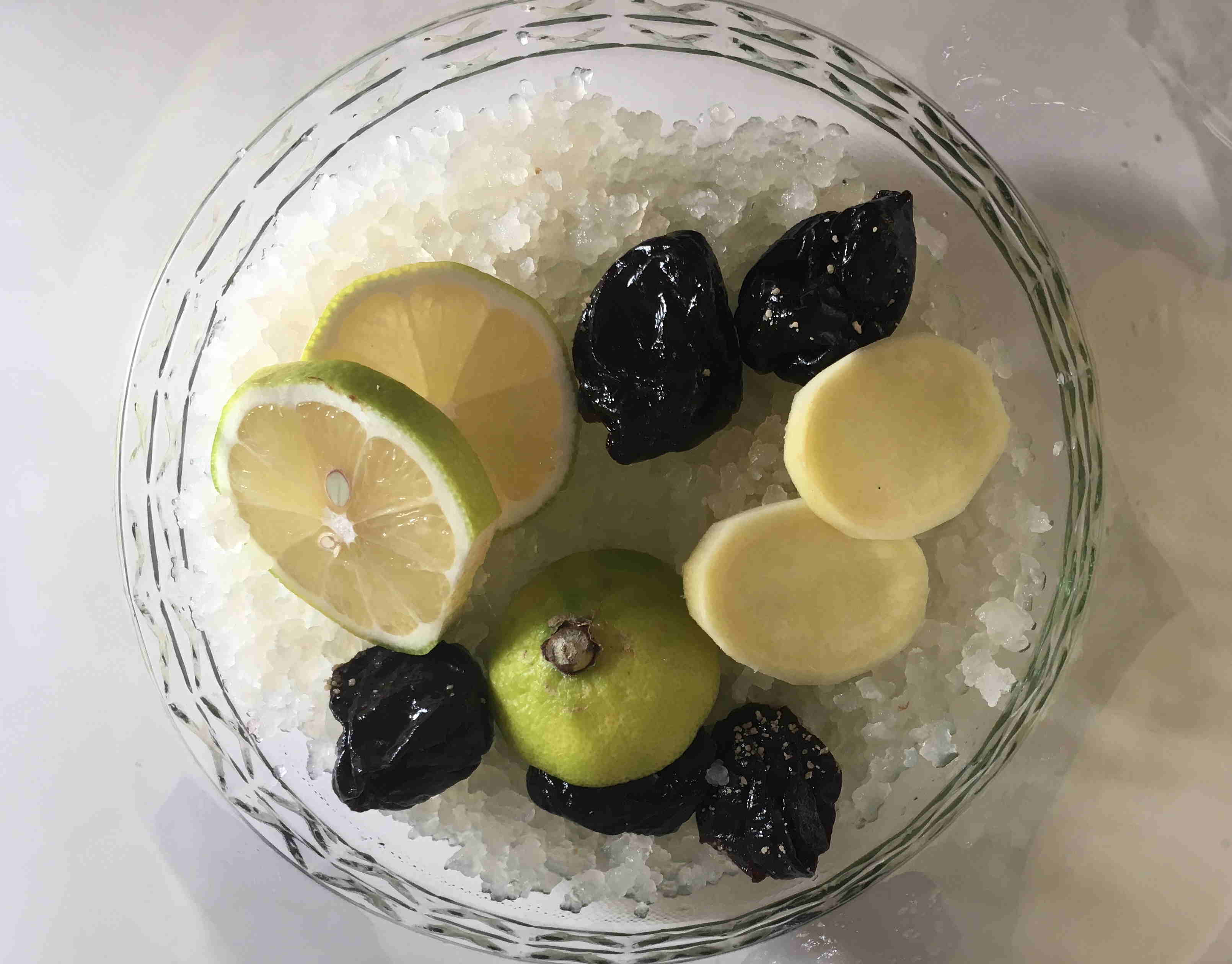 Starting out water kefir with some crystals, dried fruits and lemon